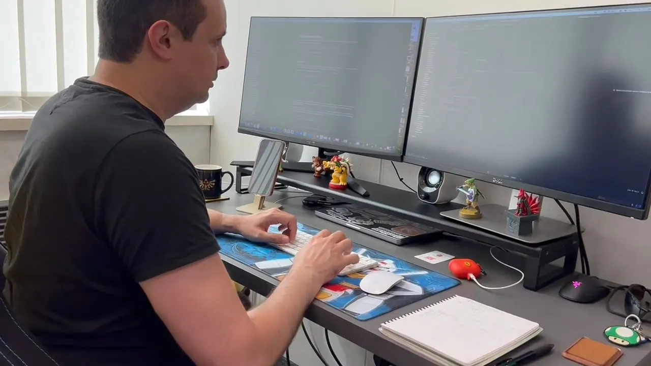 AtalayaSoft iOS developer coding at his desk, with code on screen